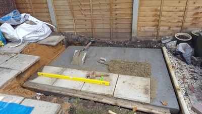 First four pavers laid on BBQ base