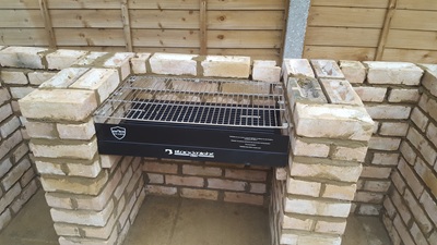 Checking BBQ fits correctly - supported on protruding bricks