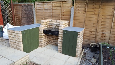 Wooden, green painted doors added to cupboards either side
