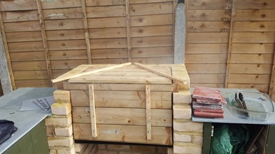 Wooden (but metal lined) enclosure added to BBQ for additional flexibility