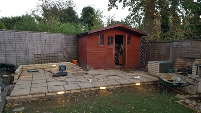 Surrounding wall, including integrated light bricks, being built