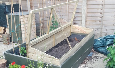 Cold frame constructed to fit over half of one of the raised beds